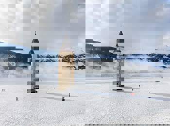 Church tower emerging from Lake Reschen